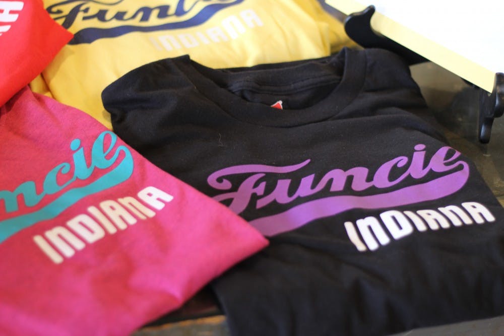 <p>Shirts reading "Funcie Indiana" are on display June 6, 2019, at the First Thursdays event in downtown Muncie. These shirts were developed by John Morris, a graphic design professor. <strong>Britney Kendrick, DN</strong></p>