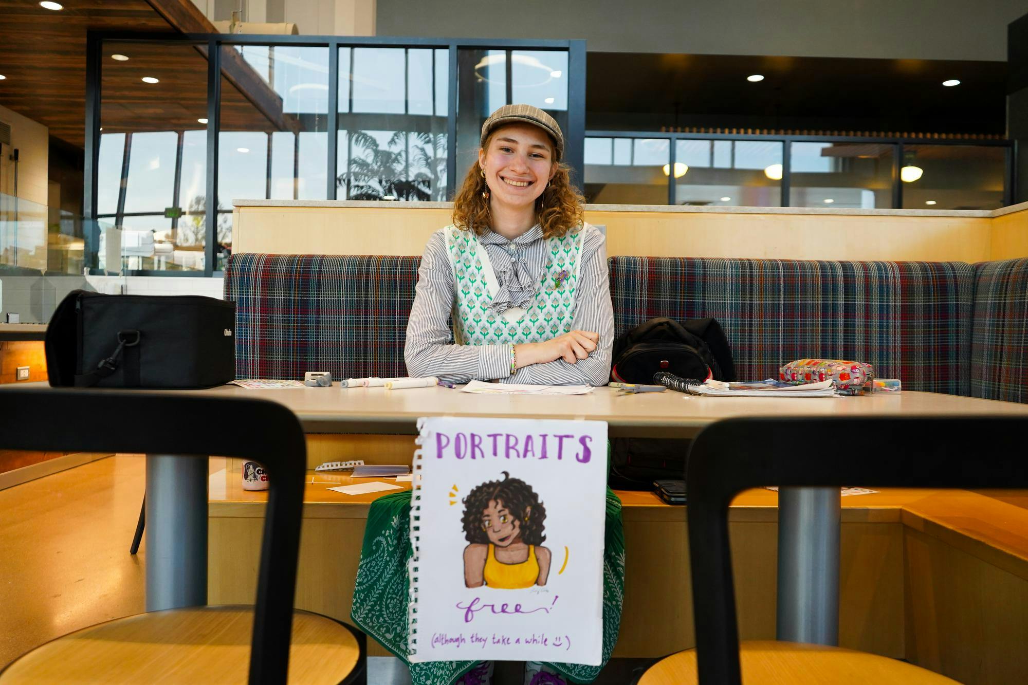 Lily Ellis sets up to draw portraits Sept. 20 in North Dinning.  Ellis is a first-year undergraduate at Ball State University majoring in both literature and history. Isabella Kemper, DN