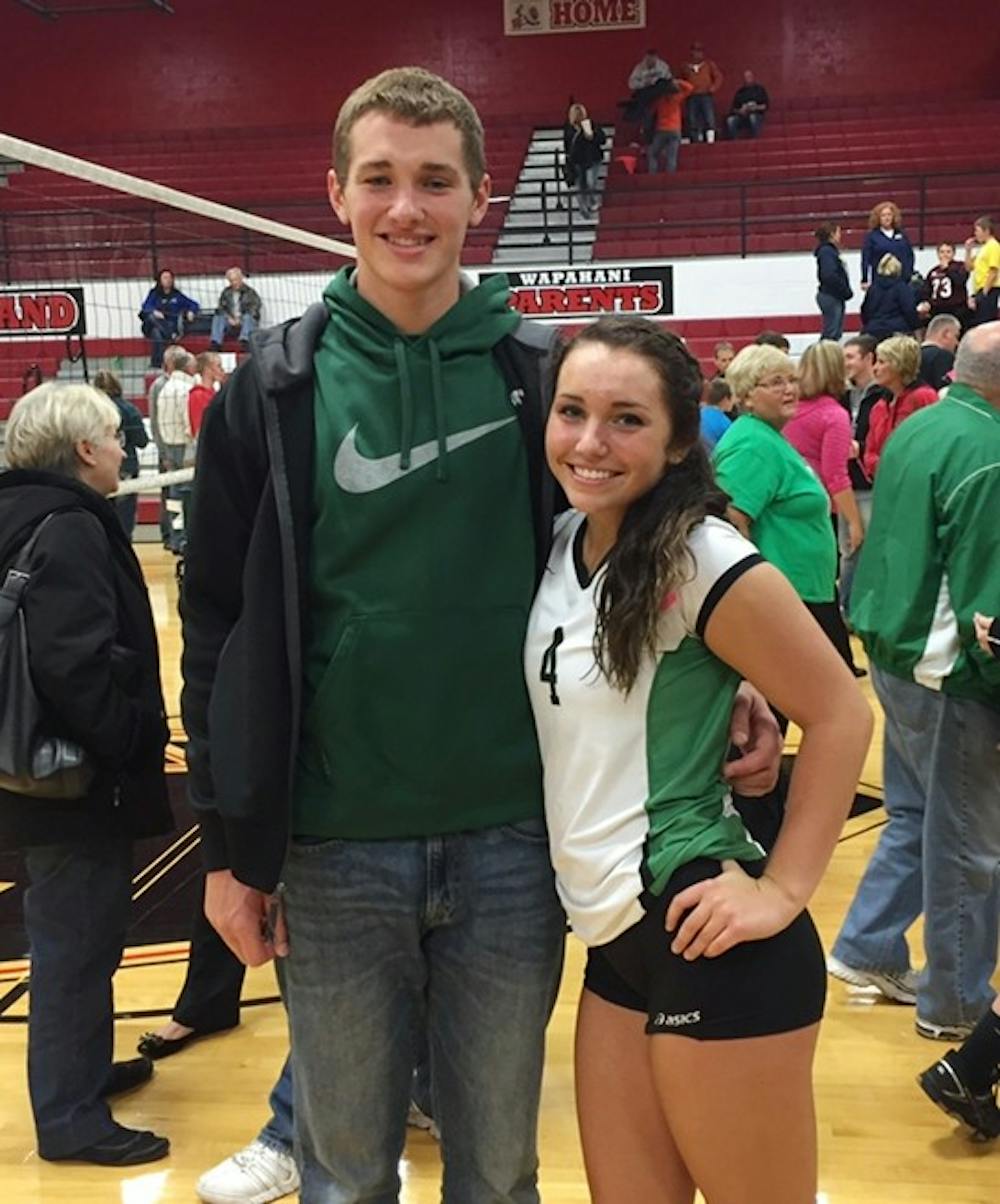 Ball State quarterback Riley Neal and his sister, Rhyen, pose for a photo following a Yorktown volleyball match at Wapahani.&nbsp;Rhyen and the Tigers play in the 3A state championship Saturday at Worthen Arena. The pair share a funny, competitive relationship at home. PHOTO PROVIDED BY RHYEN NEAL