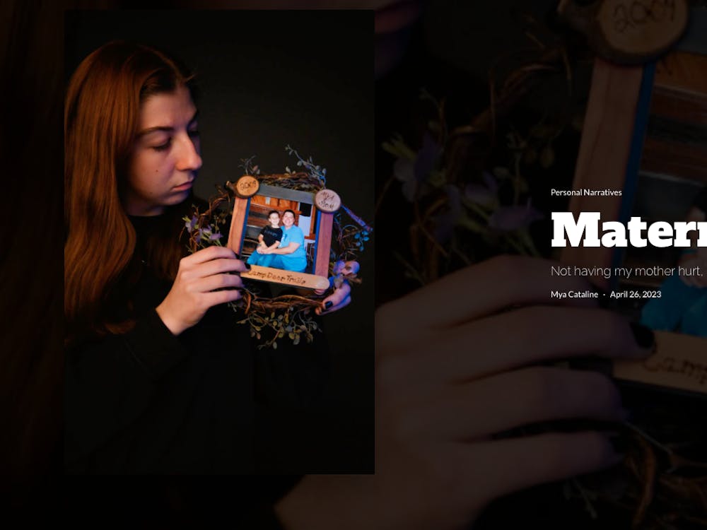 Mya Cataline glances down at a framed photo of her and her mother, dated 2009. Taken at Ball State University in Muncie, Ind. on 12 March, 2023. J. Doudt, Ball Bearings Magazine