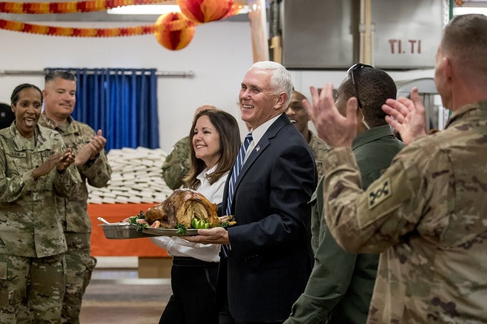 <p>Vice President Mike Pence and his wife Karen Pence arrive with turkey to serve to troops at Al Asad Air Base, Iraq, Saturday, Nov. 23, 2019. The visit is Pence’s first to Iraq and comes nearly one year since President Donald Trump’s surprise visit to the country. <strong>(AP Photo/Andrew Harnik)</strong></p>