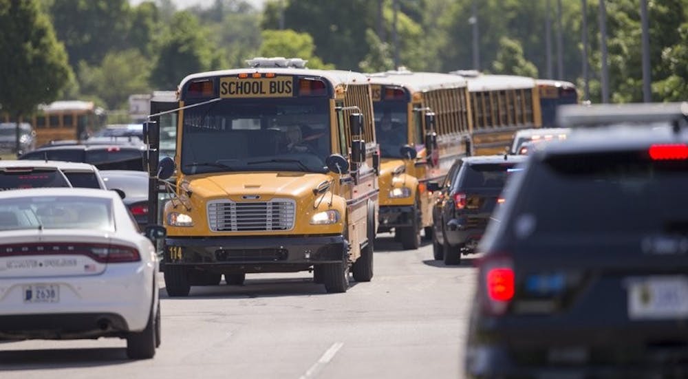 <p>Empty school buses leave after a shooting at Noblesville West Middle School in Noblesville, Ind., on Friday, May 25, 2018. A male student opened fire at the suburban Indianapolis school wounding another student and a teacher before being taken into custody, authorities said. <strong>AP Photo&nbsp;</strong></p>