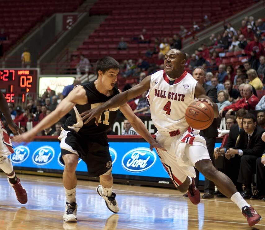 Senior guard Jauwan Scaife pushes past Wofford’s Indiana Faithfull during the game Nov. 16. Ball State took on Cleveland State on Wednesday evening and lost 69-63. DN FILE PHOTO JONATHAN MIKSANEK