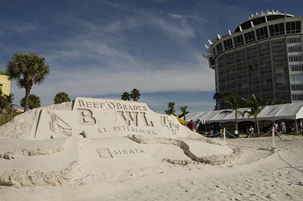A sand sculpture sits behind the Sirta Hotel on the beachfront. The sculpture is to commemorate the Beef '0 'Brady's bowl. DN PHOTO COREY OHLENKAMP