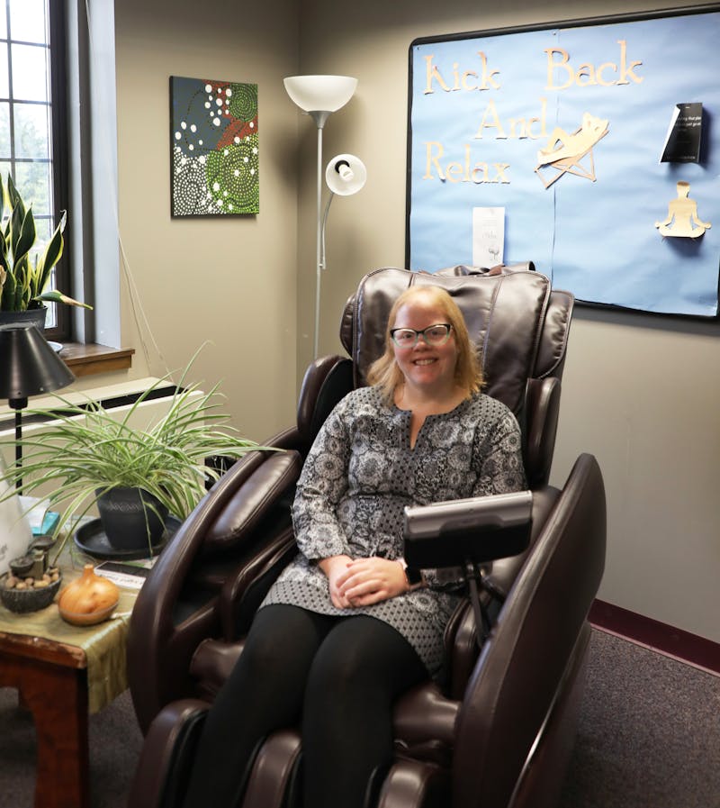 Associate director for prevention and wellness at the Ball State Counseling Center Audrey Driscoll sits in a massaging chair Sept. 25 in the Resource and Relaxation Room at Lucina Hall. The relaxation room provides information on resources, a coloring station and a massage chair. Grayson Joslin, DN