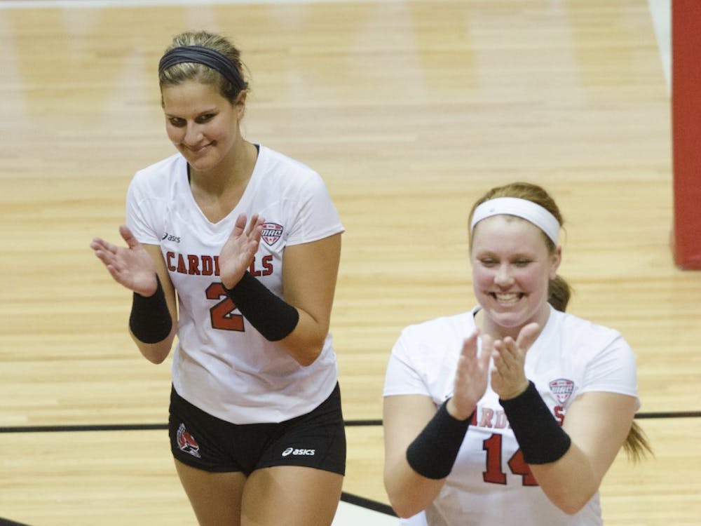 Members of the women's volleyball team celebrate after getting a point in the second game of the Active Ankle Tournament against Belmont on Aug. 28 at Worthen Arena. DN PHOTO BREANNA DAUGHERTY