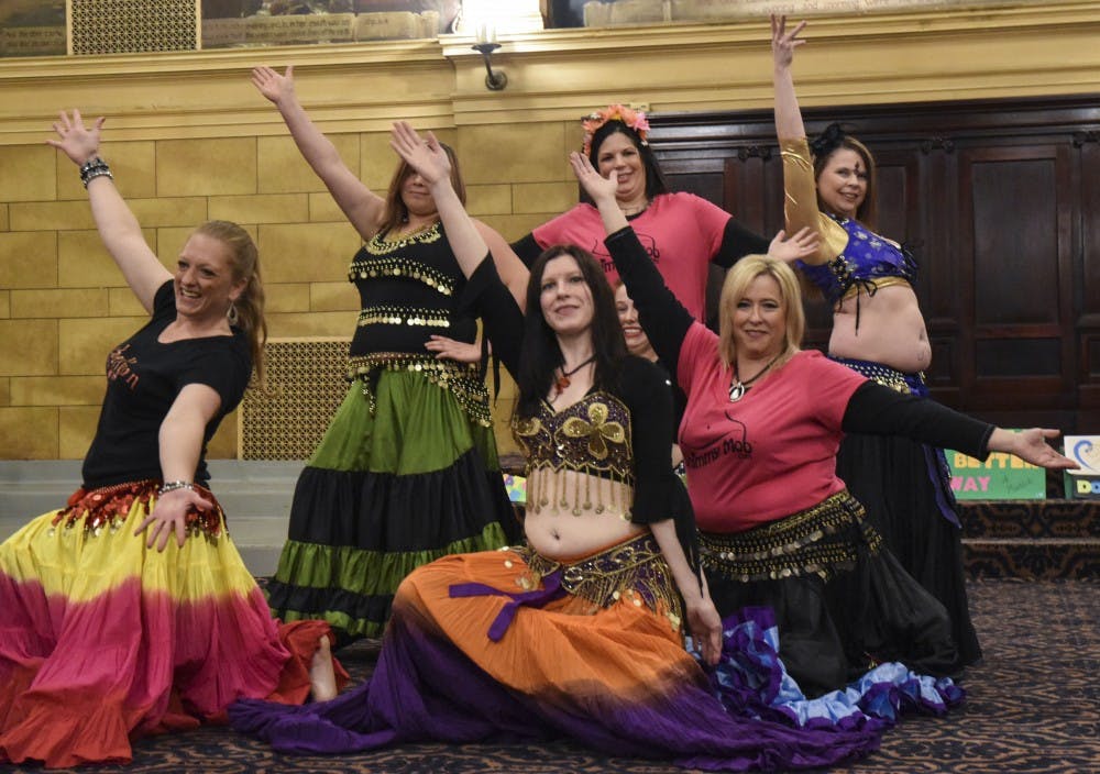 <p>A "Shimmy Mob" danced throughout downtown Muncie on May 14, ending at Cornerstone Center for the Arts for its annual fundraiser for A Better Way Women’s Shelter. <em>DN PHOTO PATRICK CALVERT</em></p>