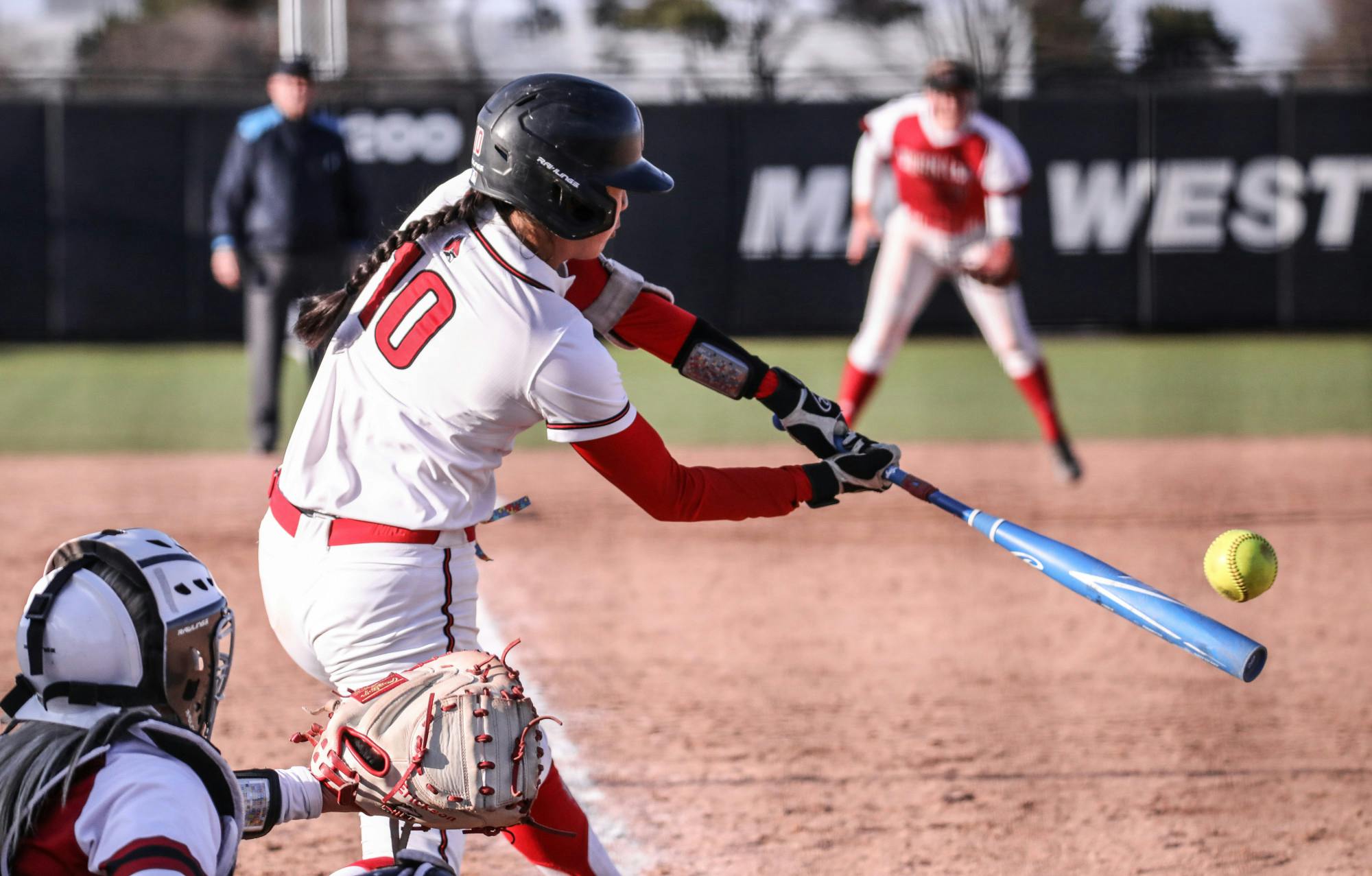 Redshirt senior utility player Jazmyne Armendariz hits the ball in a game against Northern Illinois March 28 at the First Merchants Ballpark Complex. Armendariz had two hits and one run during the game. Katelyn Howell, DN