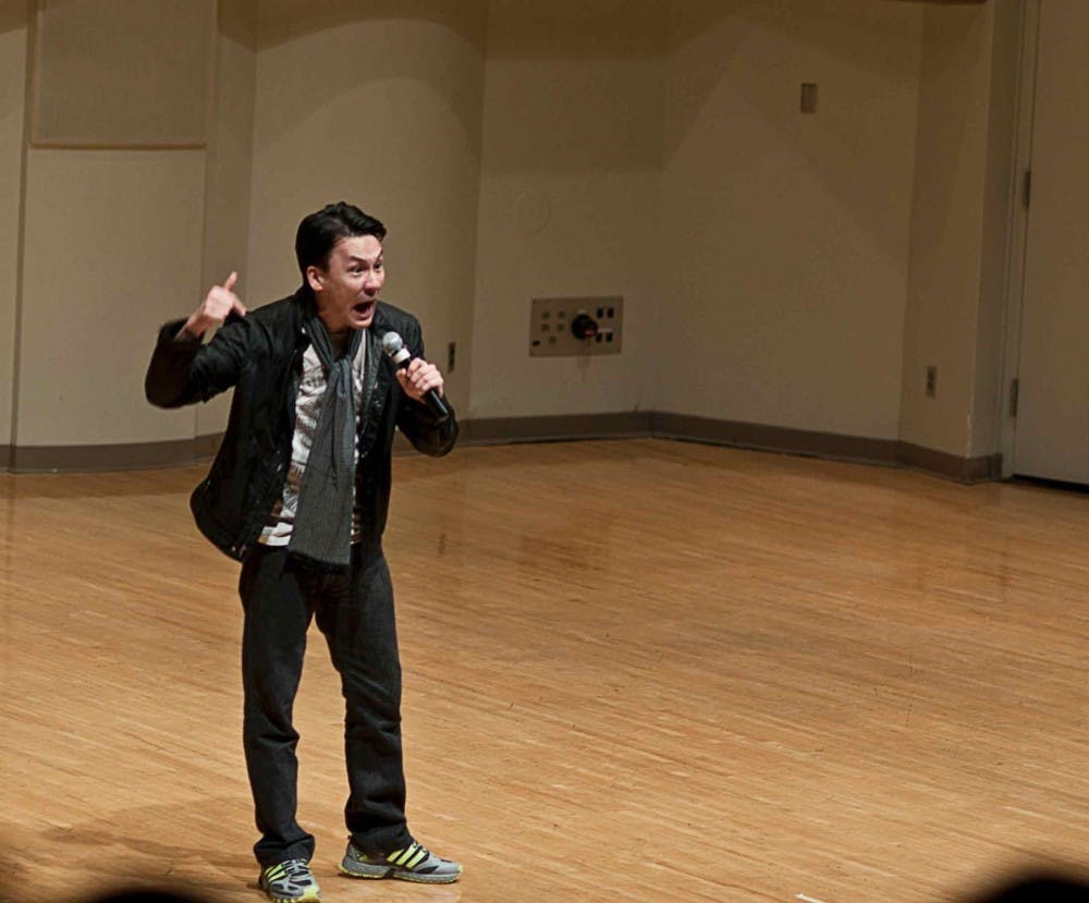 Comedian Eliot Chang performs his routine Monday night in Pruis Hall. Chang was presented by The Asian American Student Association as part of its month of events. DN PHOTO JONATHAN MIKSANEK