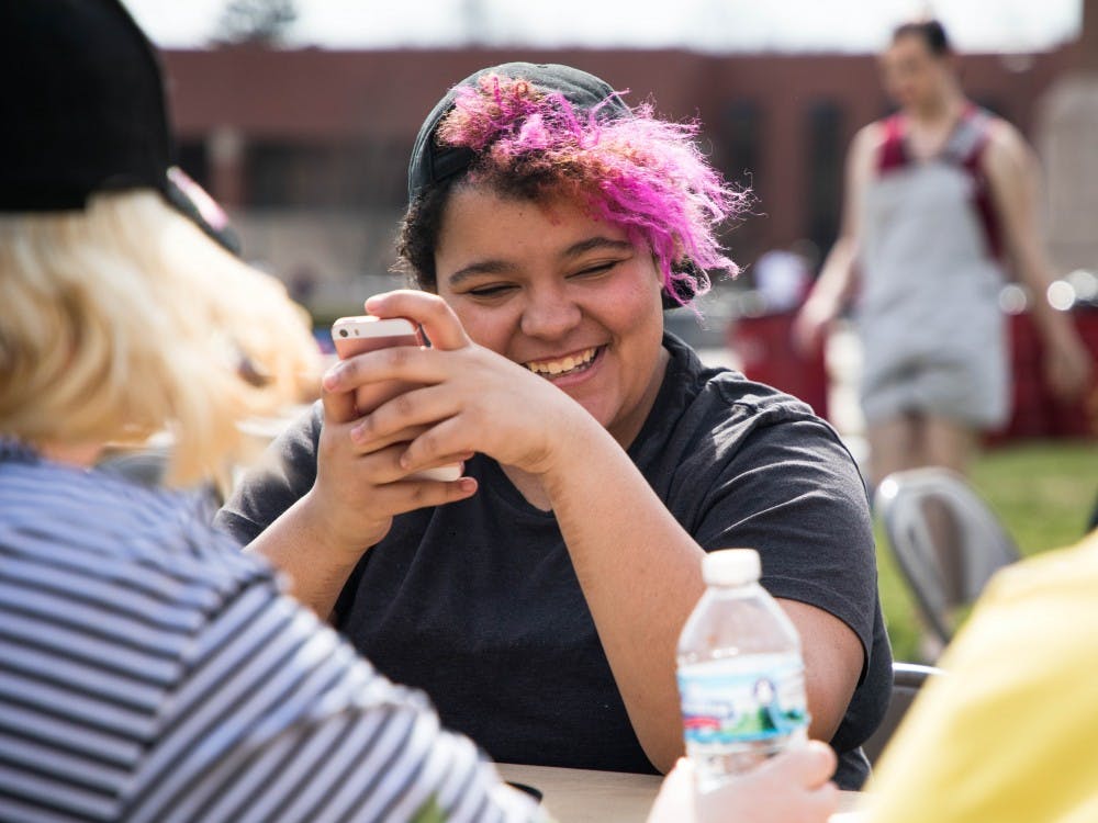 During BBQueer on University Green April 13, people gathered to eat pizza. Spectrum, the organization in charge of the event, wanted to share more about who they are and get to know people on campus. 