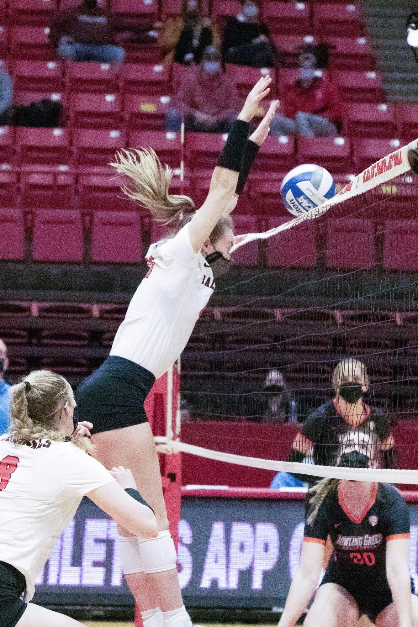 Freshman middle blocker Lauren Gilliland blocks the ball Feb. 12, 2021, in John E. Worthen Arena. The Cardinals lost to the Falcons 0-3. Madelyn Guinn, DN