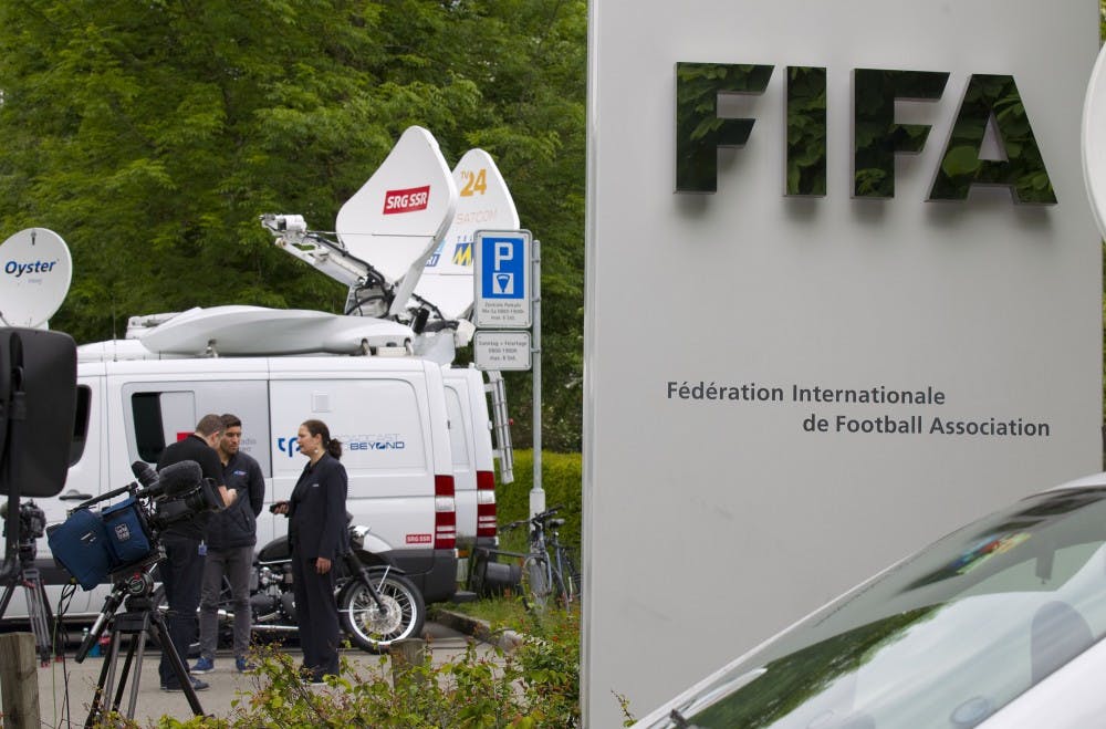 Media stand outside FIFA headquarters in Zurich, Switzerland May 27, 2015. FIFA was founded in Paris, France in 1904 with the mission of establishing a governing body for football, futsal and beach football around the world. (DDP images/Sipa USA/TNS) 