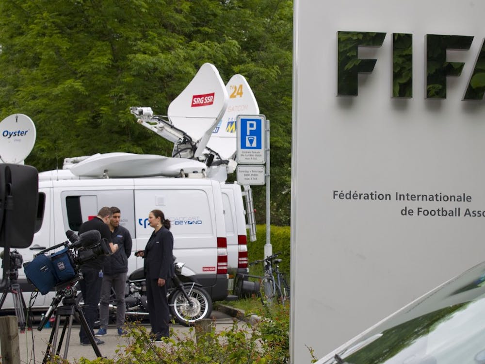 Media stand outside FIFA headquarters in Zurich, Switzerland May 27, 2015. FIFA was founded in Paris, France in 1904 with the mission of establishing a governing body for football, futsal and beach football around the world. (DDP images/Sipa USA/TNS) 