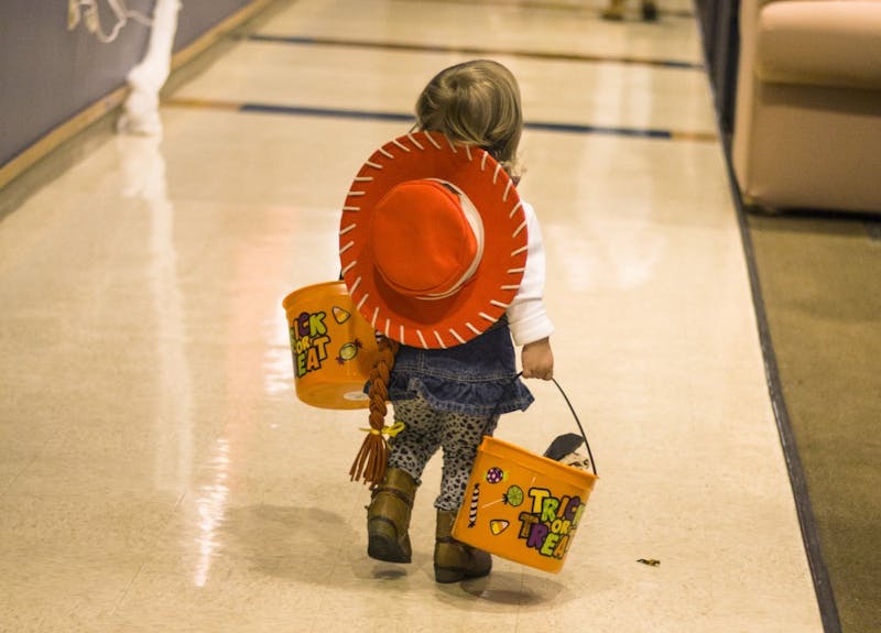 Noyer Complex hosts a trick or treat event for the children of Muncie on Oct. 27. The children can receive candy and play games at various parts of the residence hall. McKenzie Price // DN