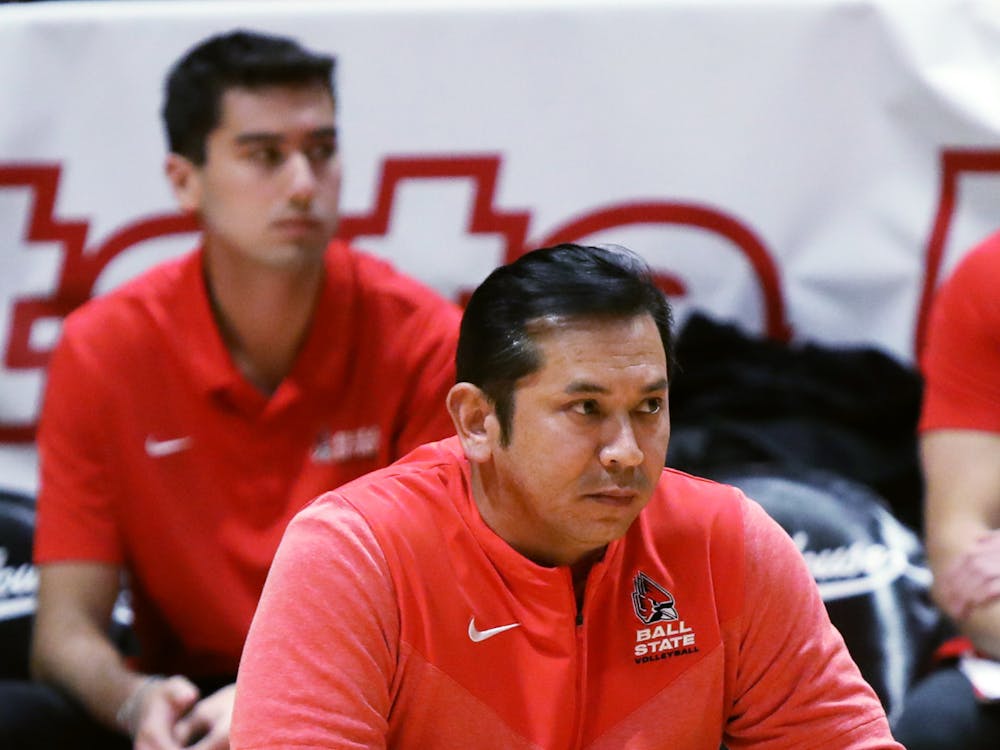 Men's Volleyball Head Coach Donan Cruz watches the game from the sidelines in a game against BYU Feb. 2 at Worthen Arena. Amber Pietz, DN
