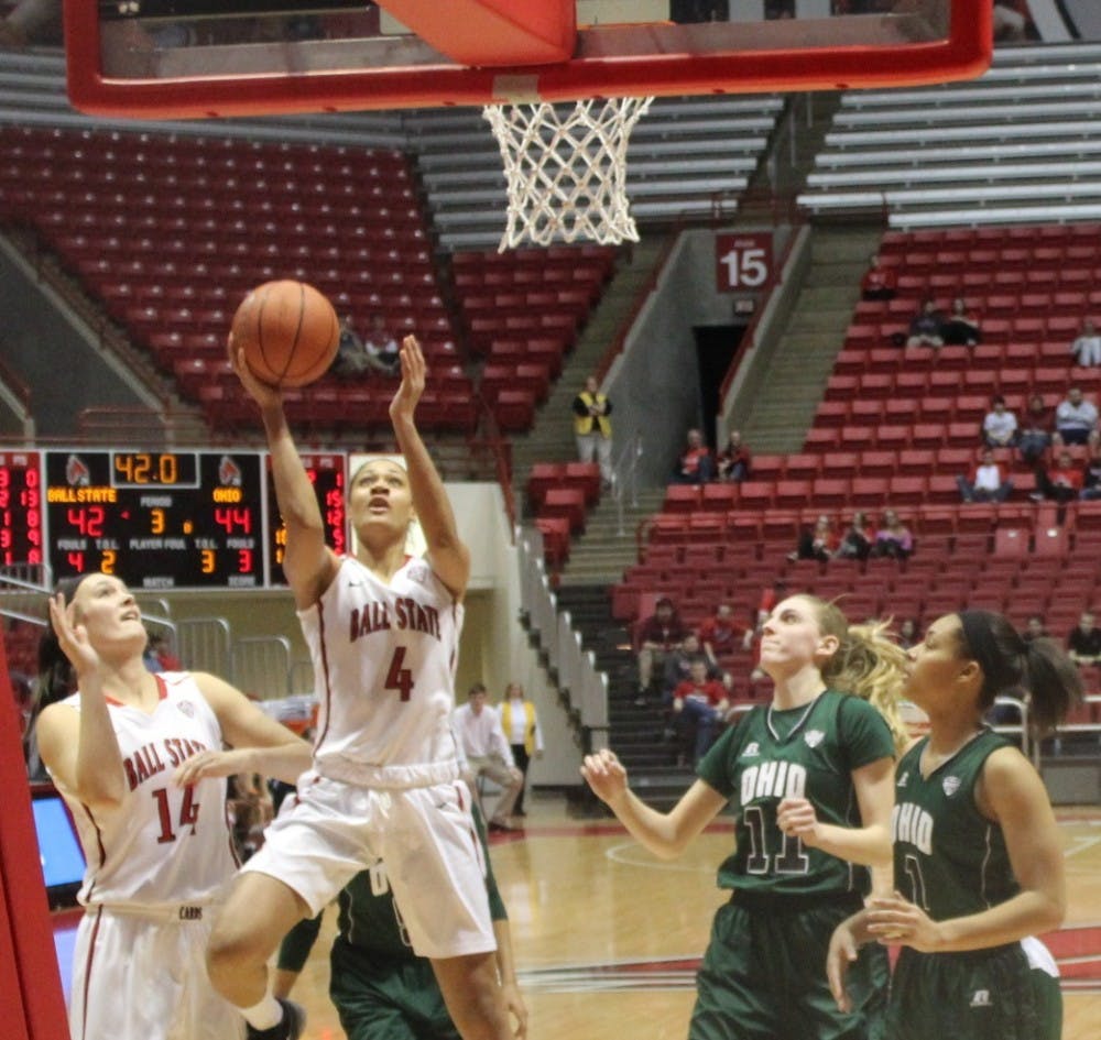 Senior guard Nathalie Fontaine attempts a layup against an Ohio defender during a game on Jan. 30 at Worthern Arena.  Fontaine had 18 points in the entire game.  DN Photo by Patrick Murphy