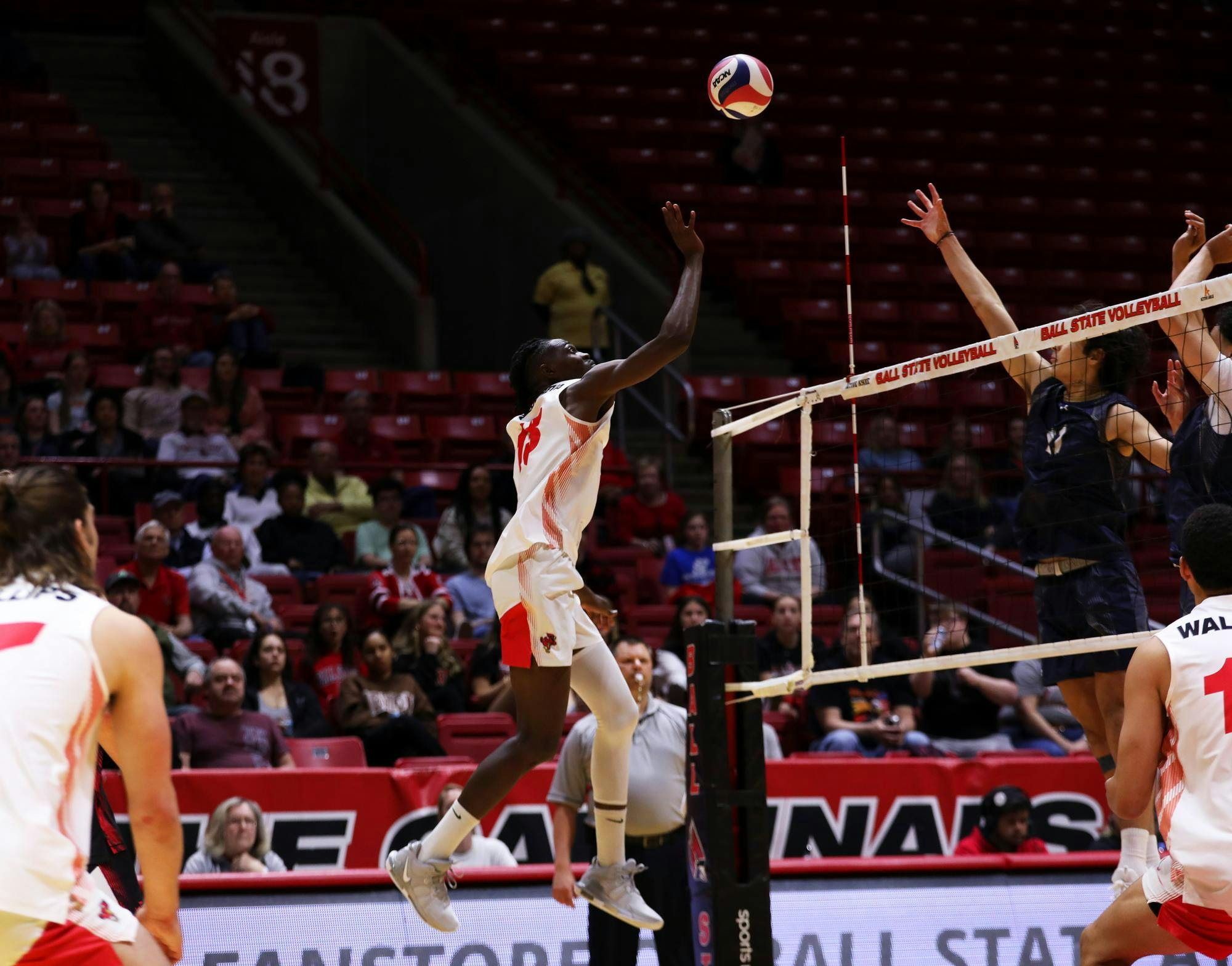 Junior opposite hitter Tinaishe Ndavazocheva tips the ball over the net against Queens April 13 at Worthen Arena. Ndavazocheva scored 15 points in the game. Mya Cataline, DN