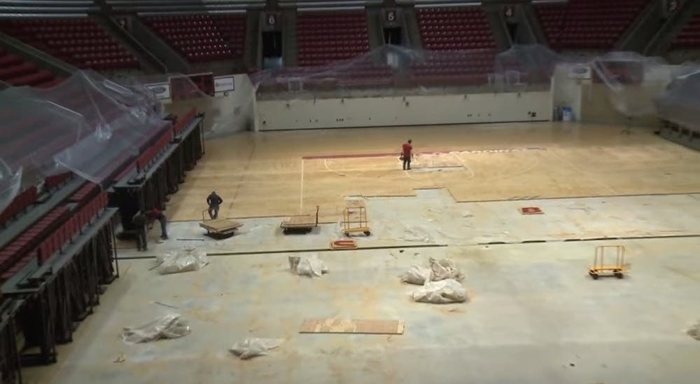 <p>Worthen Arena is getting new flooring over the summer. Workers started tearing up the floor piece by piece, all the way down to the concrete. <em>PHOTO COURTESY OF BALL STATE ATHLETICS</em></p>