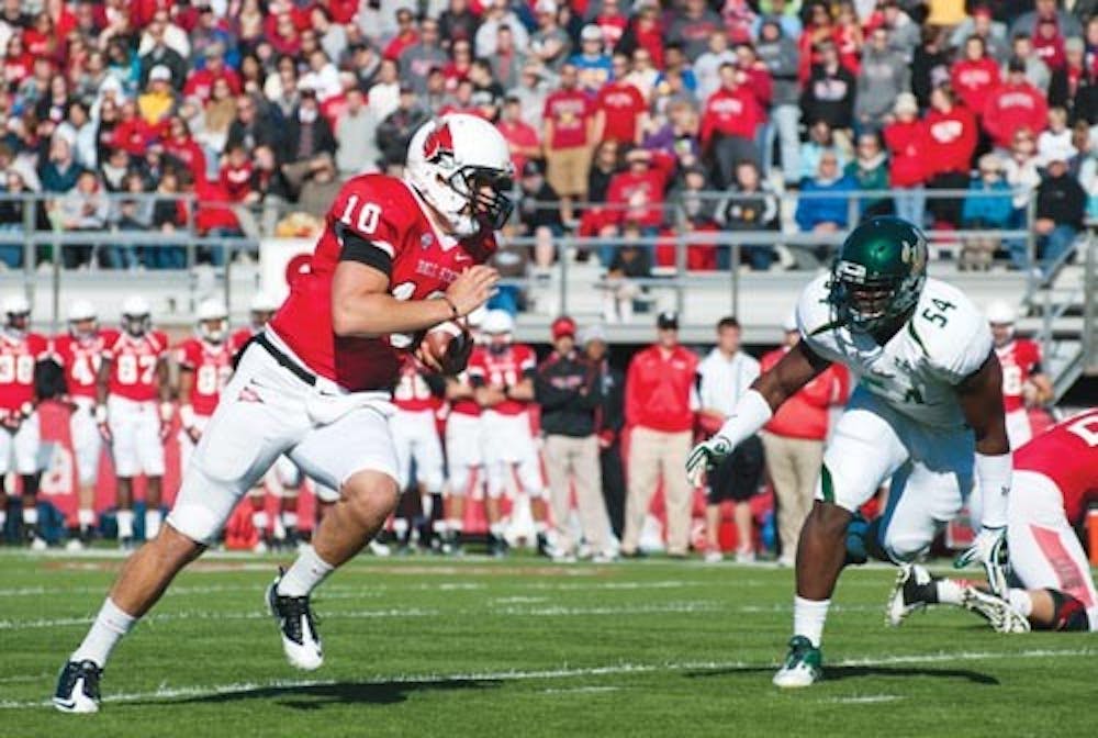 Quarterback Keith Wenning attempts to make a push past the Southern Florida defense on Sept. 22, 2012. Wenning and Travis Freeman were named team MVP for the season. DN FILE PHOTO JONATHAN MIKSANEK