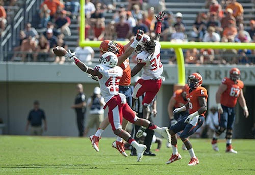 Freshman safety Dae'Shaun Hurley dives for a pass on Oct. 5 during the game against the University of Virginia. Ball State won 48-27. PHOTO PROVIDED BY MARSHALL BRONFIN AND THE CAVALIER DAILY