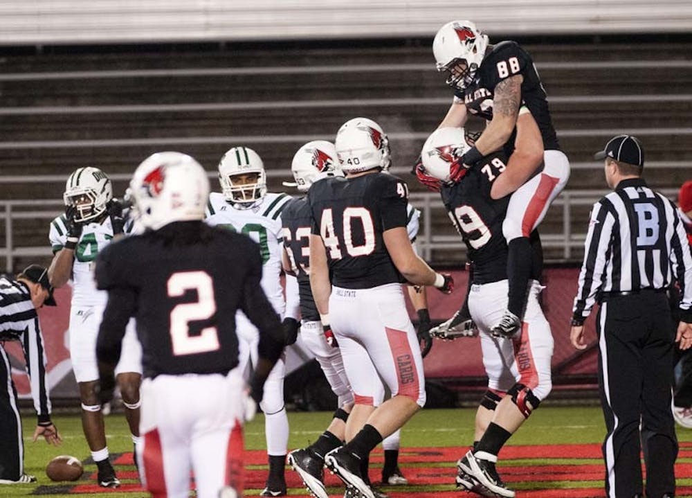 Tight end Zane Fakes is lifted by teammates after scoring a touchdown. DN PHOTO BOBBY ELLIS