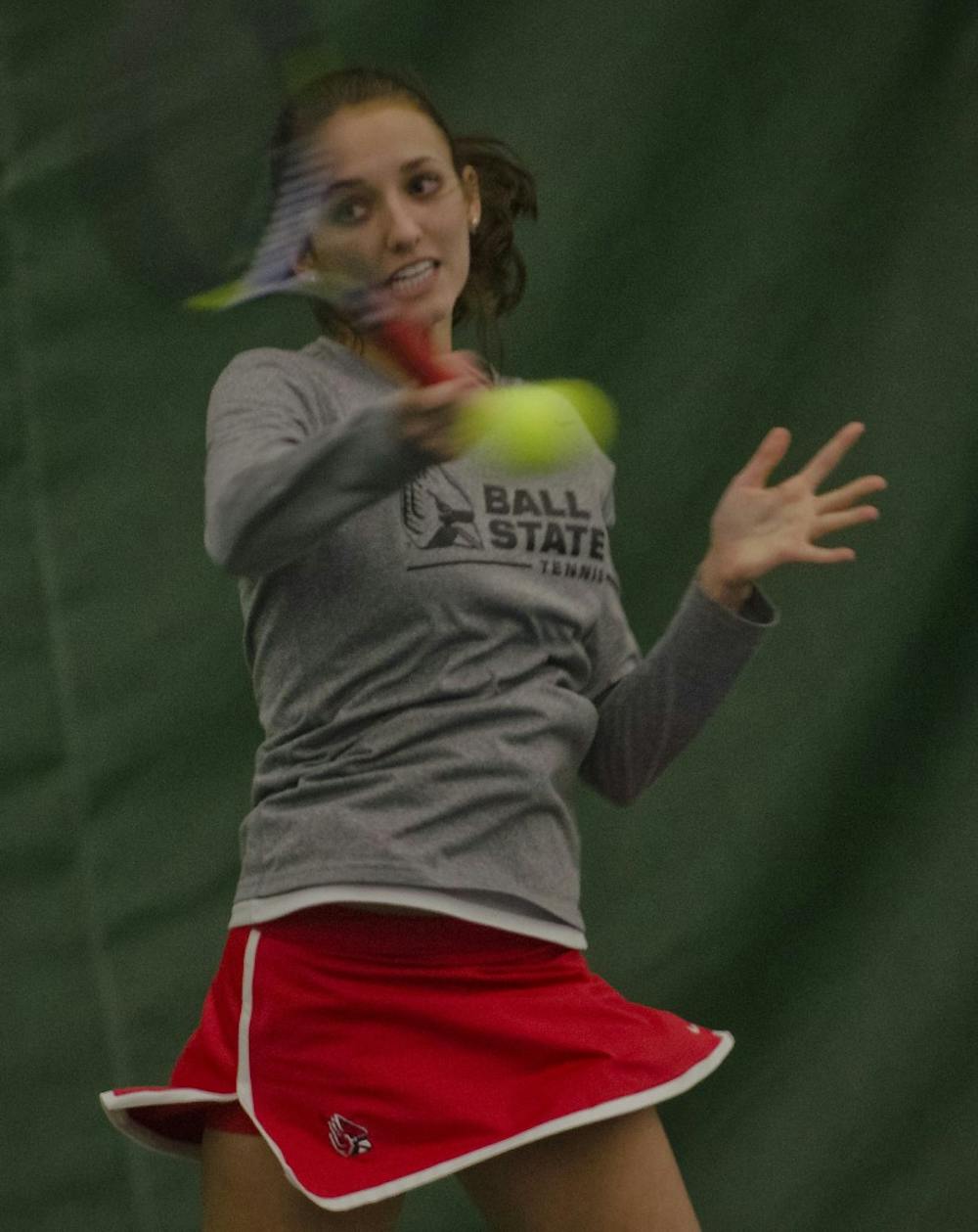 Ball State sophomore Courtney Earnest strikes a forehand against Valparaiso in the No. 2 singles match Jan. 17 at the Northwest YMCA in Muncie. DN PHOTO MARCEY BURTON