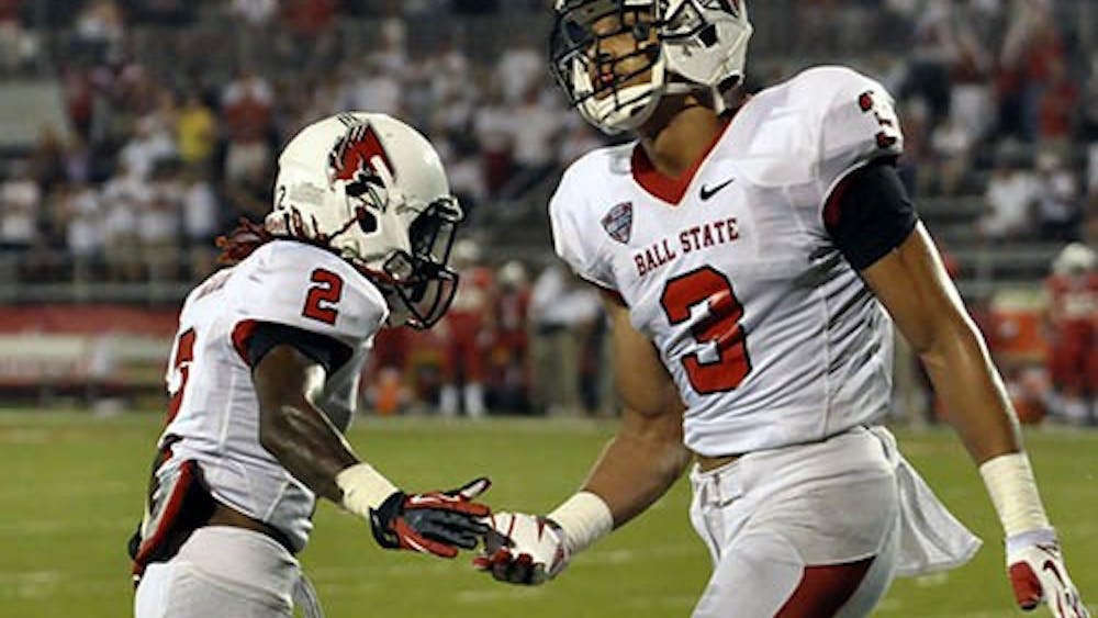 Senior Wide Receiver Jamill Smith and junior wide receiver Willie Snead congratulate one another during the game against Illinois State on Aug. 29. Ball State will take on Army this Saturday at Schuemann Stadium
