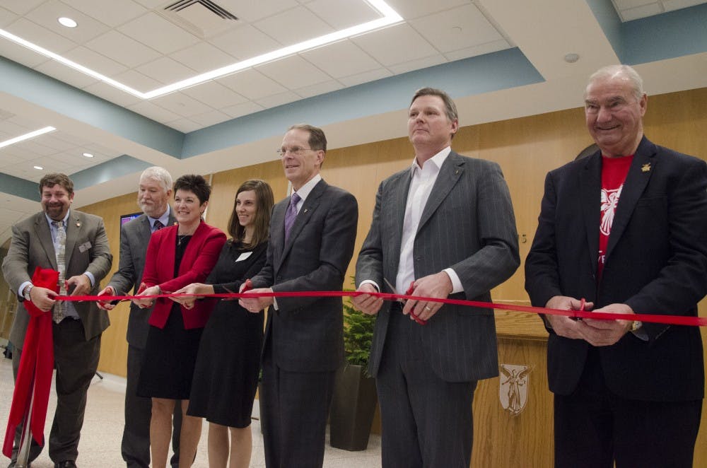 <p>University officials cut a ribbon at the reopening of the John R. Emens auditorium Nov. 10. <strong>Andrew Smith, DN Photo</strong></p>