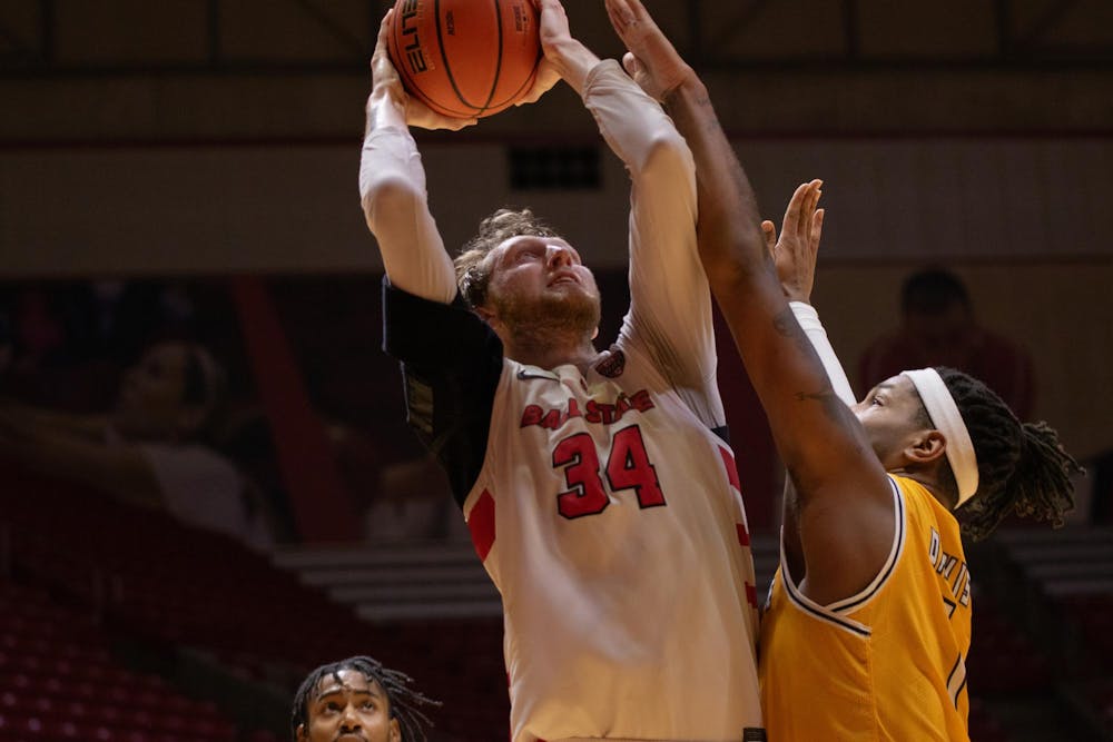 Junior center Ben Hendricks puts the ball up for two against Kent State Mar. 5 at Worthen Arena. Hendricks scored 11 points in the game. Kate Tilbury, DN