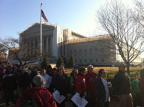 Members of the public wait in line for the chance to catch a brief glimpse of oral arguments as the Supreme Court ponders California’s Proposition 8 in Washington on Tuesday, March 26, 2013. MCT PHOTO