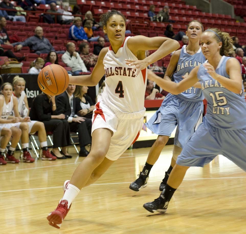 Freshmen Nathalie Fontaine drives past the Oakland defense. DN PHOTO COREY OHLENKMP