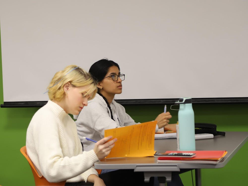 Indiana Academy junior Ella Robinson (left) and sophomore Ayesha Khan (right) attend s duel credit class Nov. 17 at the Indiana Academy. Robinson says that duel credit classes offered from Ball State make her secondary education dreams more achievable. Olivia Ground, DN