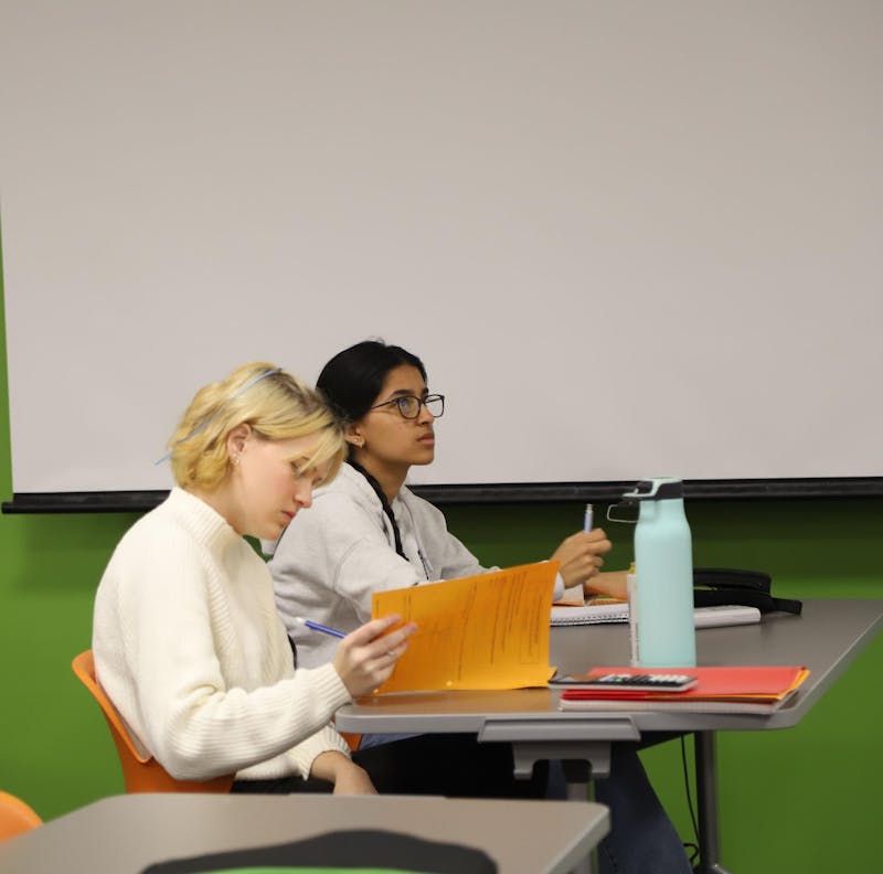 Indiana Academy junior Ella Robinson (left) and sophomore Ayesha Khan (right) attend s duel credit class Nov. 17 at the Indiana Academy. Robinson says that duel credit classes offered from Ball State make her secondary education dreams more achievable. Olivia Ground, DN