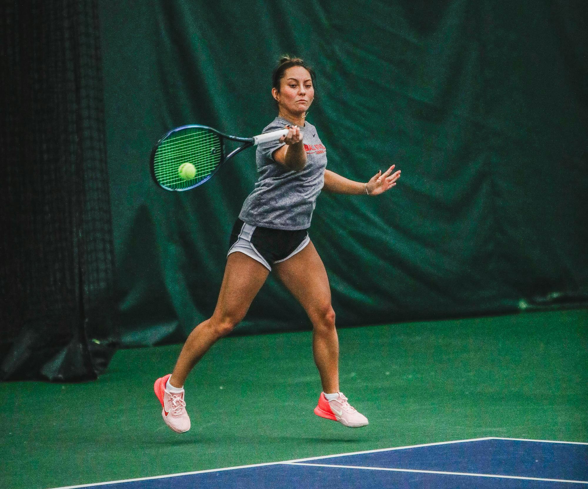 Freshman Isabel Tanjuatco hits the ball Jan. 10 during practice at Muncie YMCA. Andrew Berger, DN 
