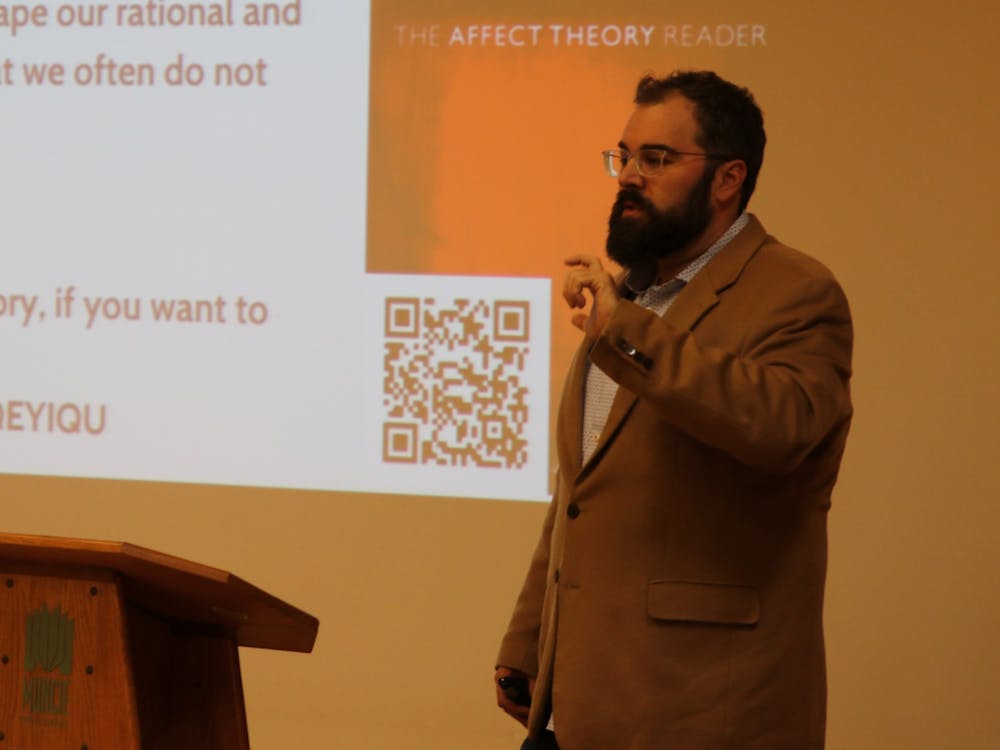 Dr. Matthew R. Hotham, an assistant professor of religious studies, speaks at the Muncie Kennedy Library Branch in the program &quot;Big Questions, Big Ideas.&quot; Hotham spoke about dogs and Islamophobia in Europe and North America. Elijah Poe, DN