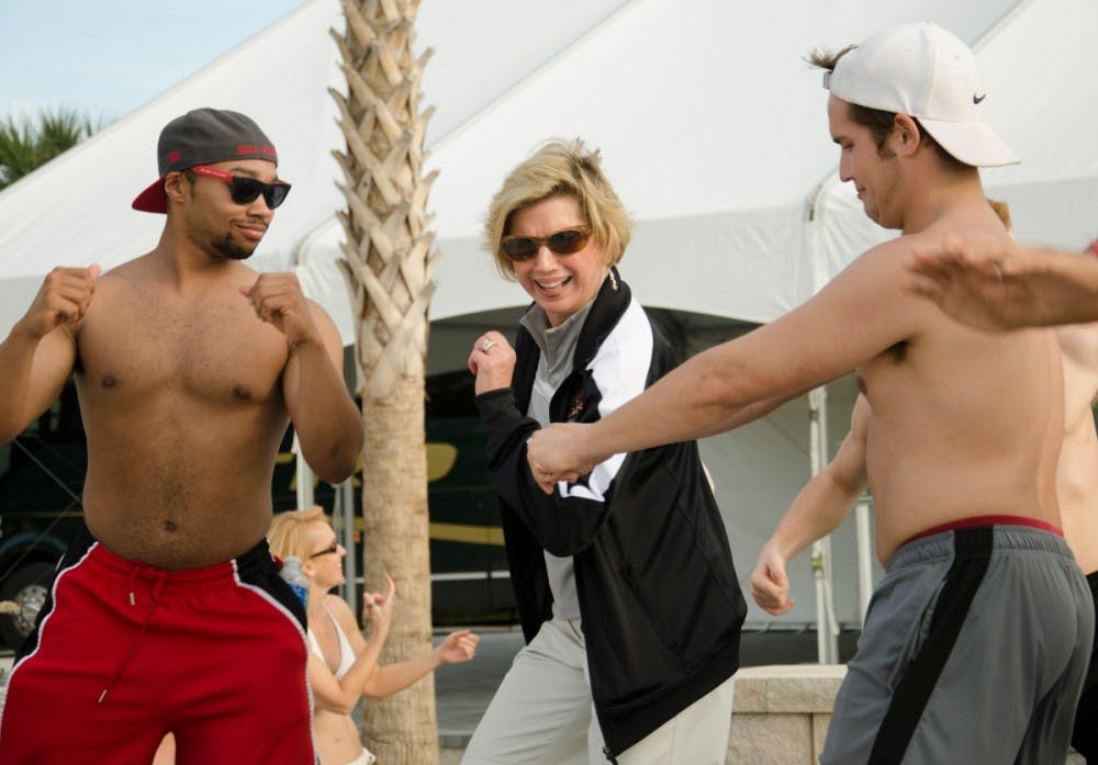 Ball State University President Jo Ann Gora dances with Ball State fans after an afternoon of competition between the Ball State Pride of Mid-America Marching Band and the University of Central Florida Marching Knights on Dec. 20 in St. Petersburg, Fla. DN FILE PHOTO COREY OHLENKAMP