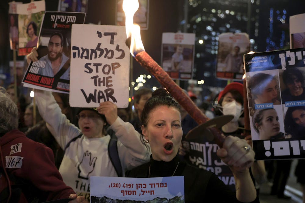 <p>TEL AVIV, ISRAEL - JANUARY 15: People take part in a rally calling for the return of hostages held in the Gaza Strip amid reports of a possible Gaza cease fire and hostage release deal being reached on January 15, 2025 in Tel Aviv, Israel. A ceasefire deal between Israel and Hamas was announced tonight that would entail the release of Israeli hostages held in Gaza, according to officials from Hamas, the United States, and other parties. (Photo by Amir Levy/Getty Images/TNS)</p>