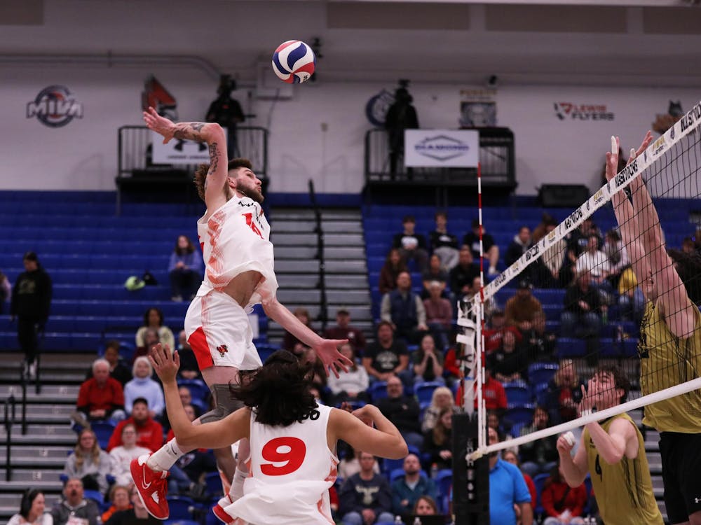 Graduate Student middle blocker Wil McPhillips spikes the ball against Purdue Fort Wayne March 23 at Gates Center in Fort Wayne, Indiana. McPhillips scored seven points in the game. Mya Cataline, DN