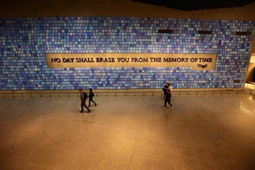 <p>One wall inside the National September 11 Memorial &amp; Museum boasts a quote from Virgil’s “The Aeneid.” Though scholars have debated its use, the quote is commonly interpreted to remind visitors of the nearly 3,000 people who were killed as a result of the terrorist attacks on America, on Sept. 11, 2001. <strong>Lisa Renze-Rhodes, Photo Provided</strong></p>