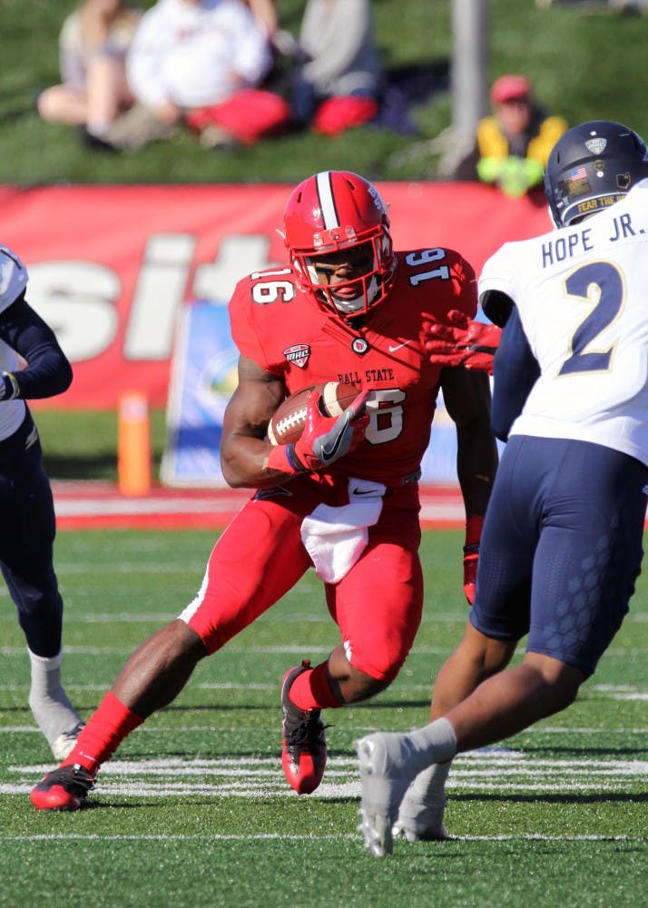 Wide receiver KeVonn Mabon dodges a defender while running the ball during the Cardinals’ game against Akron on Oct. 22 in Scheumann Stadium. Ball State lost 25 to 35. Paige Grider// DN