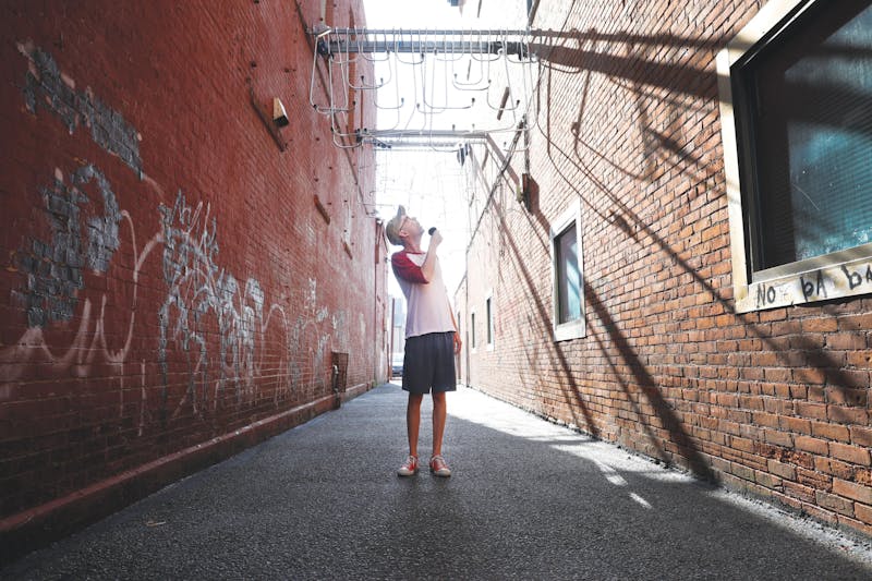 Stevie Hahn, known online as "Ray Toffer," poses for a portrait in Dave's Alley in downtown Muncie Aug. 17. Jacy Bradley, DN