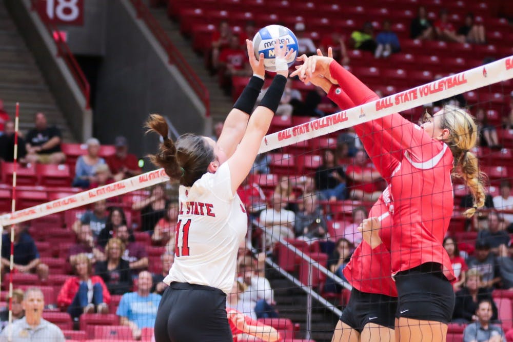 Freshman setter Amber Seaman blocks the ball at the game against Ohio State on Sept. 17 at John E. Worthen Arena. Ball State lost 0-3. Kyle Crawford // DN