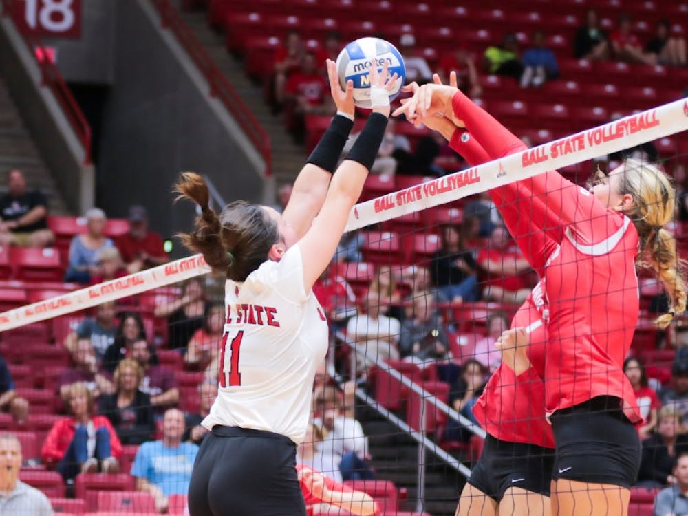 Freshman setter Amber Seaman blocks the ball at the game against Ohio State on Sept. 17 at John E. Worthen Arena. Ball State lost 0-3. Kyle Crawford // DN