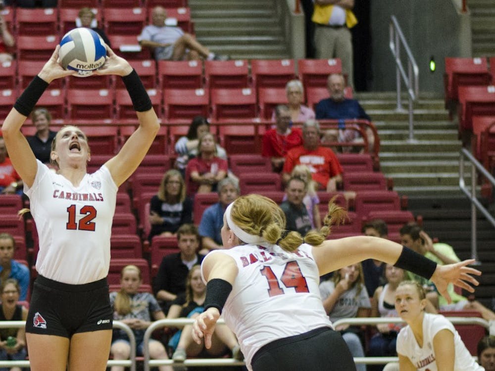 Senior setter Jenna Spadafora sets the ball for a teammate in the second game of the Active Ankle Tournament against Belmont on Aug. 28 at Worthen Arena. DN PHOTO BREANNA DAUGHERTY