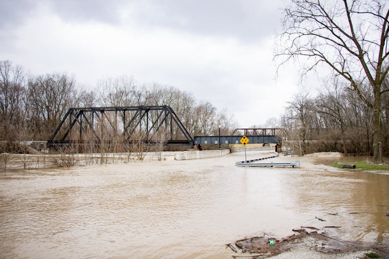 East McCulloch boulevard floods during a day of heavy rain fall April, 4, 2018, in Muncie. The White River began to dam under bridges from debris which cause trails and roads to flood. Eric Pritchett, DN