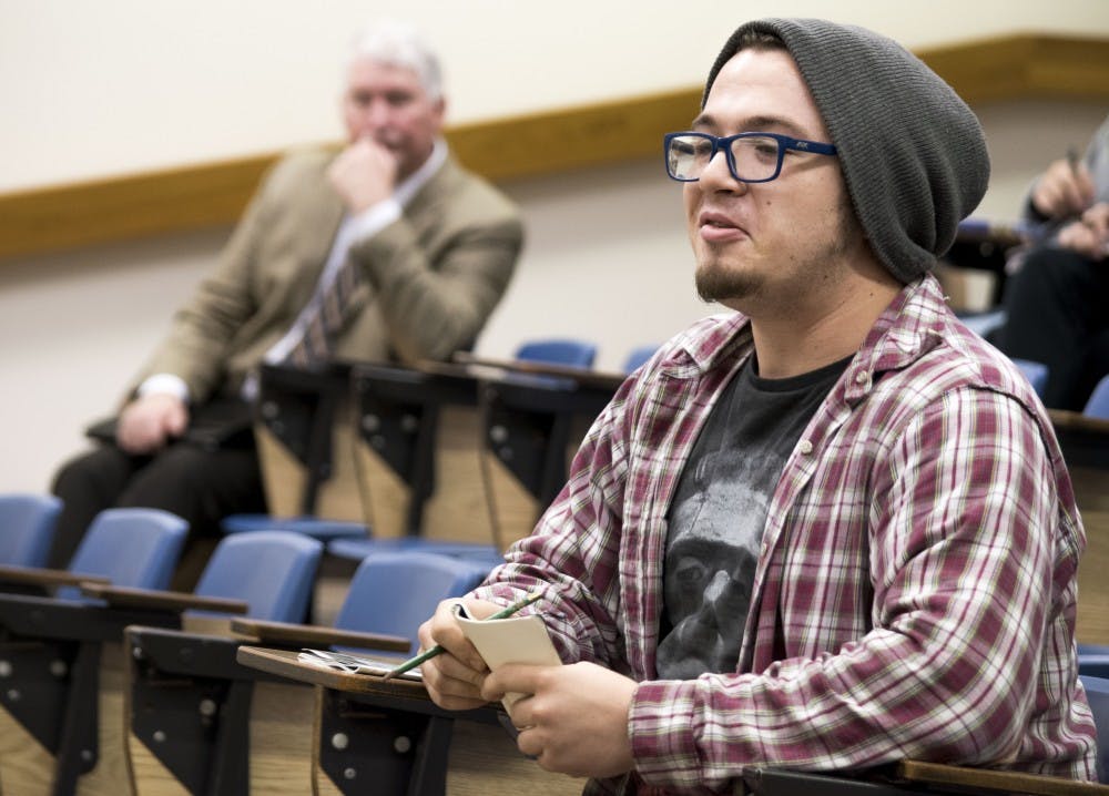 Junior Griffith Williams, intermediate photography major, comes to the Student open forum on April 22, at the Burkhart building to ask questions about the search for a new president and to share his opinions about it. DN PHOTO STEPHANIE AMADOR