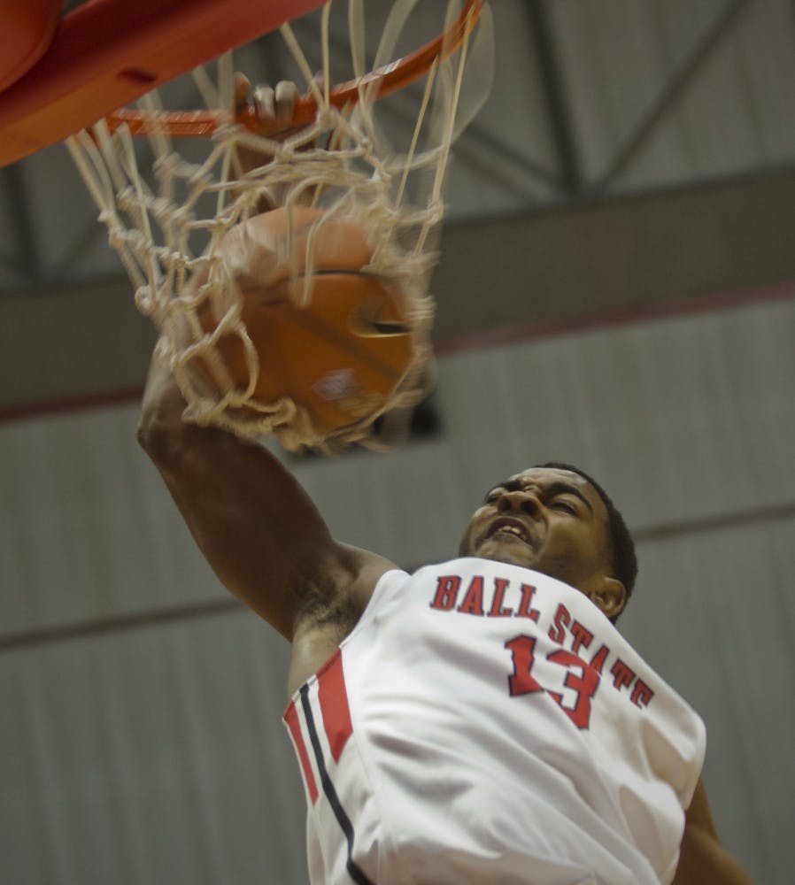 Ball State freshman Mark Alstork ends a fast break with a dunk against Southeast Missouri on Nov. 18 at Worthen Arena. DN PHOTO MARCEY BURTON