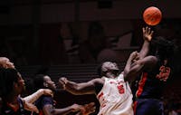 Senior center Payton Sparks reaches for a rebound against Detroit Mercy Nov. 20 at Worthen Arena. Sparks had seven rebounds in the game. Andrew Berger, DN