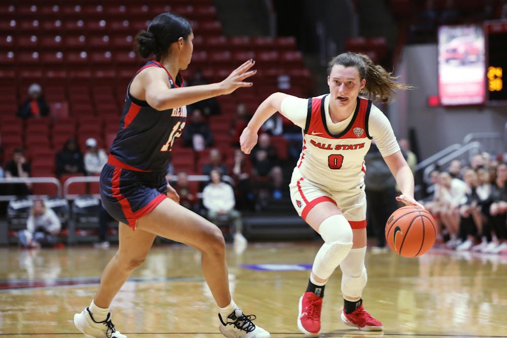 Sophomore Ally Becki dribbles the ball in a game against Belmont in the WNIT Tournament March 16 at Worthen Arena. Becki had 13 assists during the game. Amber Pietz, DN