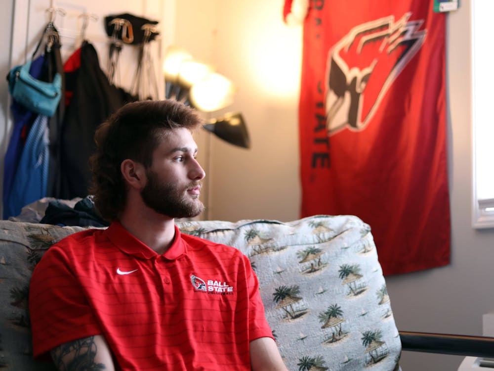 Will McPhillips gazes out the window Sept. 5 in his apartment. After more than a year of healing, McPhillips has made a full recovery, and has continued to play volleyball for Ball State. 